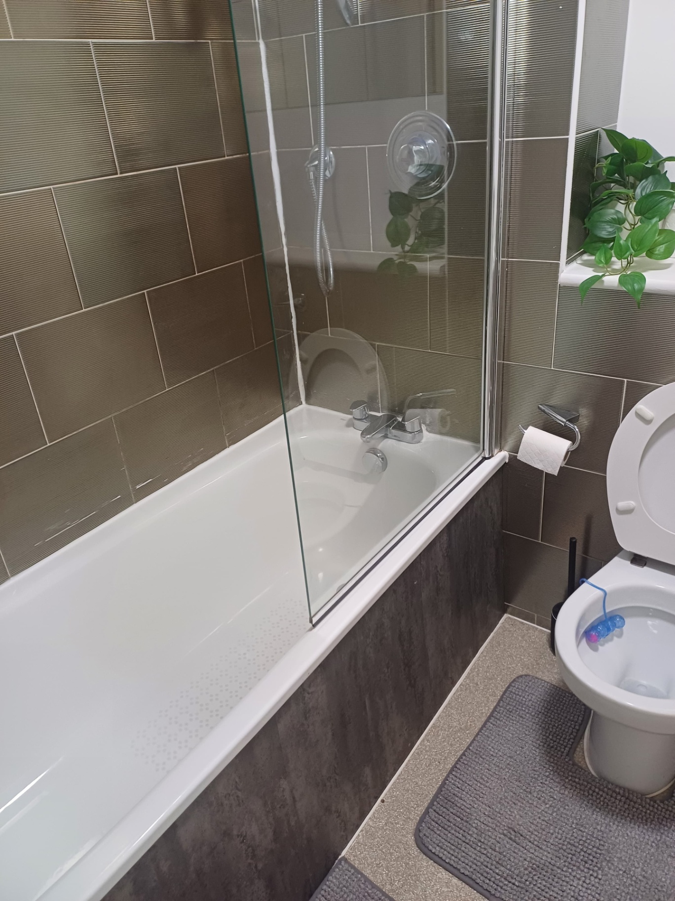 Sparkling bathroom with bath and shower